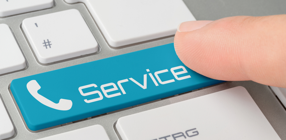Picture of a keyboard with a blue service button implying you can press to call Cybersecurity Consultancies